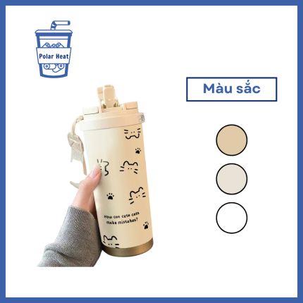 Bình giữ nhiệt điện tử giữa bàn bếp đầy đồ ăn và ly nước